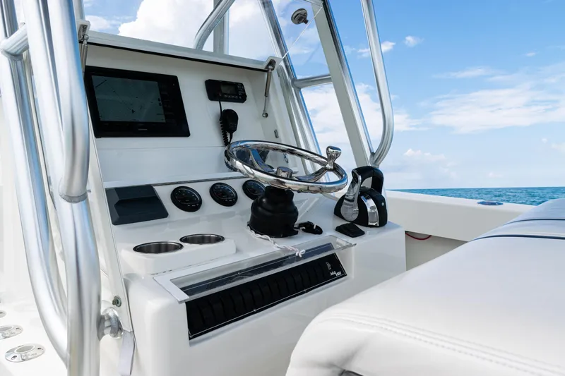  Yacht Photos Pics 2018 SeaVee 29 boat helm with steering wheel and navigation equipment.