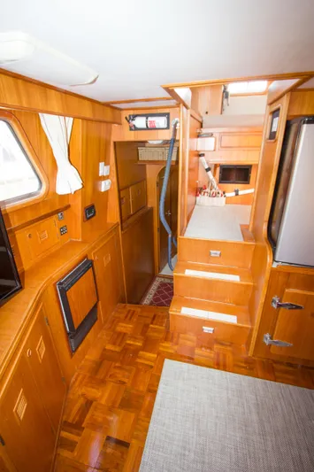 Seascape Yacht Photos Pics Interior of 1989 Cheoy Lee 53 yacht with wooden cabinetry and modern amenities.