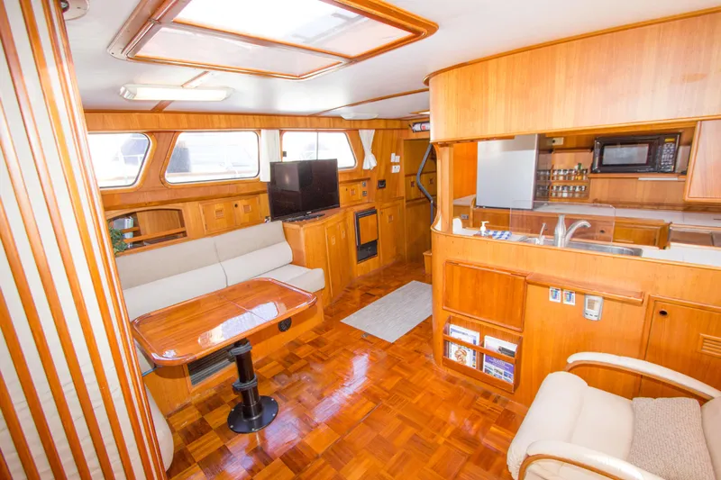 Seascape Yacht Photos Pics Interior of 1989 Cheoy Lee 53 yacht with wood finishes and modern amenities.