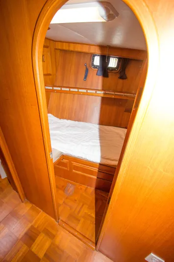 Seascape Yacht Photos Pics Cozy cabin interior of 1989 Cheoy Lee 53 yacht with wooden finish.