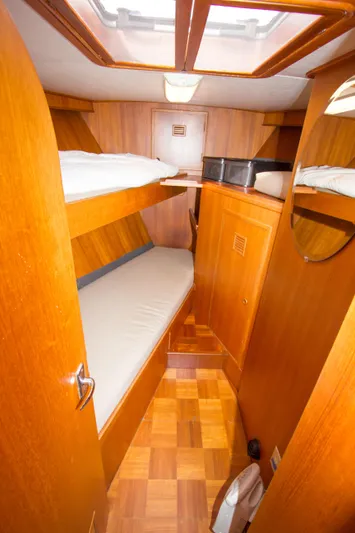 Seascape Yacht Photos Pics 1989 Cheoy Lee 53 yacht cabin with wooden interior and bunk beds.