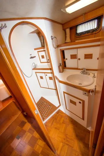 Seascape Yacht Photos Pics 1989 Cheoy Lee 53 yacht bathroom with wooden accents and compact design.