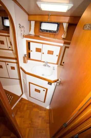Seascape Yacht Photos Pics 1989 Cheoy Lee 53 yacht bathroom with wood accents and compact sink area.