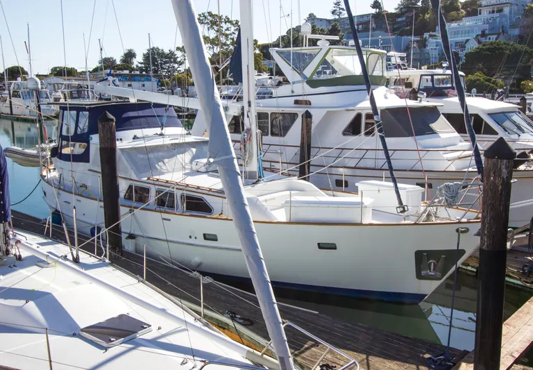 Seascape Yacht Photos Pics 1989 Cheoy Lee 53 yacht docked in a marina, surrounded by other boats.