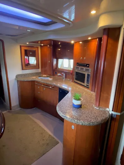  Yacht Photos Pics Luxurious 2006 Sea Ray 44 Sundancer yacht interior with modern kitchen and elegant wood finishes.