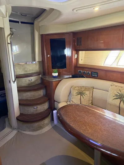  Yacht Photos Pics Interior of 2006 Sea Ray 44 Sundancer yacht with elegant seating and wooden finishes.