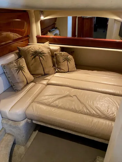  Yacht Photos Pics Interior of 2006 Sea Ray 44 Sundancer with beige leather seating and palm tree pillows.