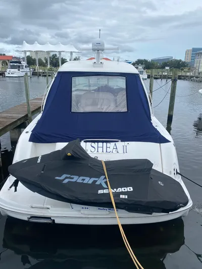  Yacht Photos Pics 2006 Sea Ray 44 Sundancer docked with Sea-Doo Spark jet ski on the swim platform.