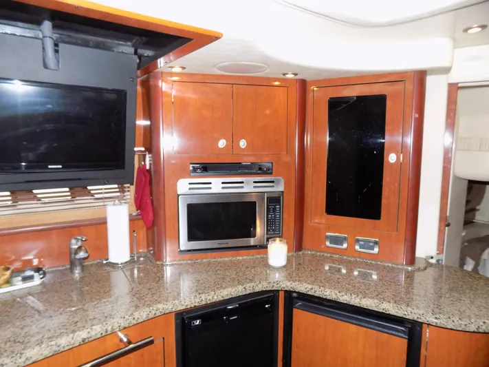  Yacht Photos Pics 2006 Sea Ray 44 Sundancer kitchen with granite countertops and modern appliances.