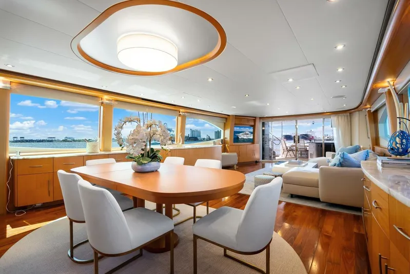 Serenity Yacht Photos Pics Luxurious interior of a 2008 Lazzara motor yacht with elegant dining and seating area.