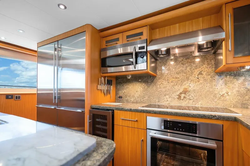 Serenity Yacht Photos Pics Luxurious kitchen interior of a 2008 Lazzara Motor Yacht with modern appliances.