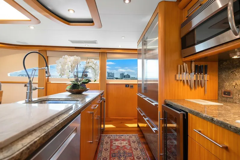 Serenity Yacht Photos Pics Luxurious kitchen interior of 2008 Lazzara Motor Yacht with modern appliances and elegant design.