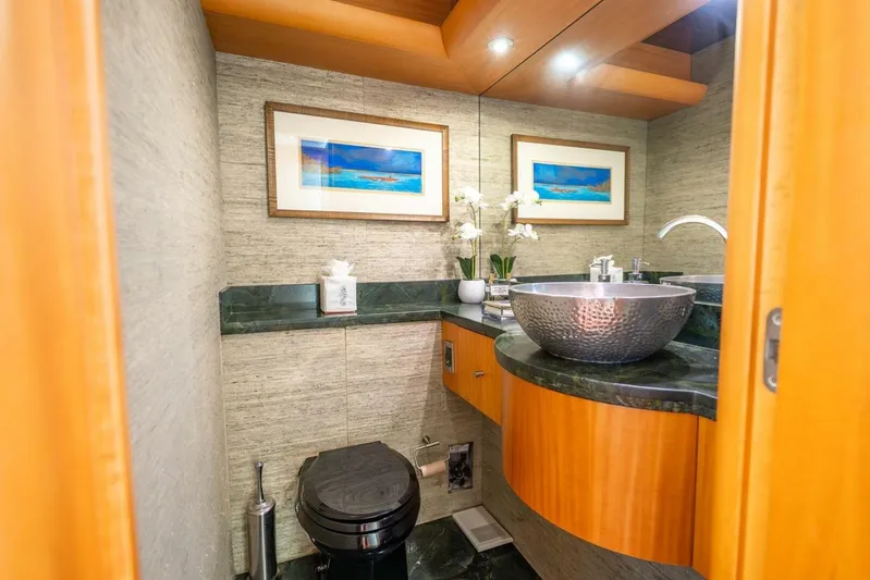 Serenity Yacht Photos Pics Luxurious bathroom on 2008 Lazzara Motor Yacht with modern sink and elegant decor.