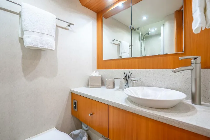 Serenity Yacht Photos Pics Luxurious bathroom in 2008 Lazzara Motor Yacht with modern fixtures and elegant design.