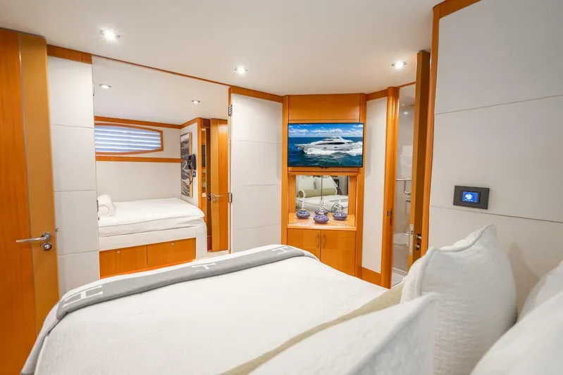 Serenity Yacht Photos Pics Luxurious 2008 Lazzara Motor Yacht bedroom with modern decor and cozy bedding.