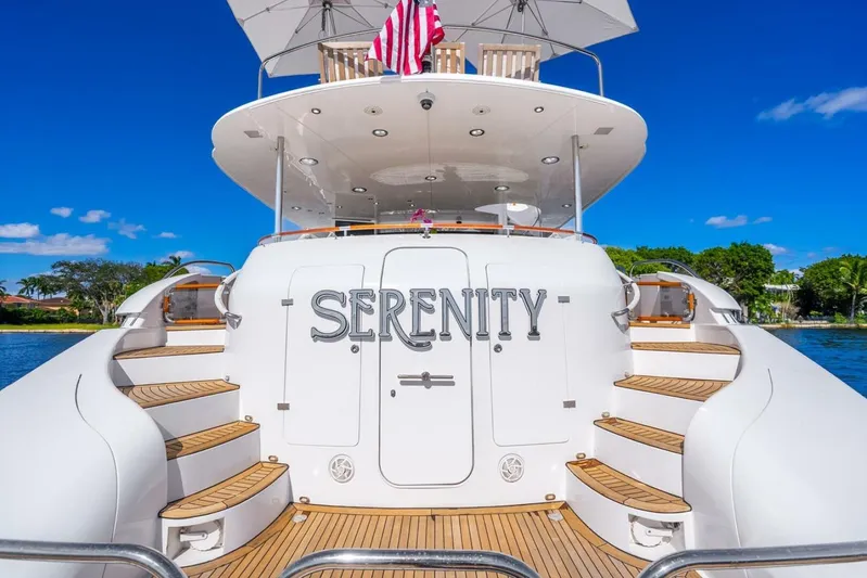 Serenity Yacht Photos Pics 2008 Lazzara Motor Yacht "Serenity" with elegant design and wooden steps, docked under clear skies.