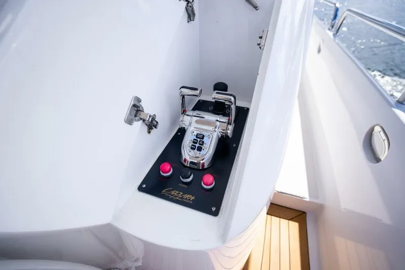 Serenity Yacht Photos Pics Control panel of a 2008 Lazzara Motor Yacht, featuring sleek design and modern controls.