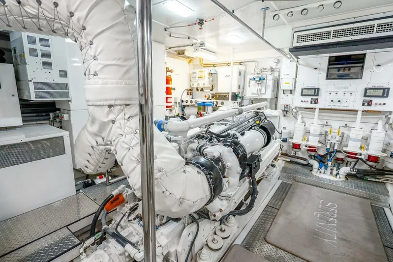 Serenity Yacht Photos Pics Engine room of a 2008 Lazzara Motor Yacht, showcasing advanced machinery and control systems.