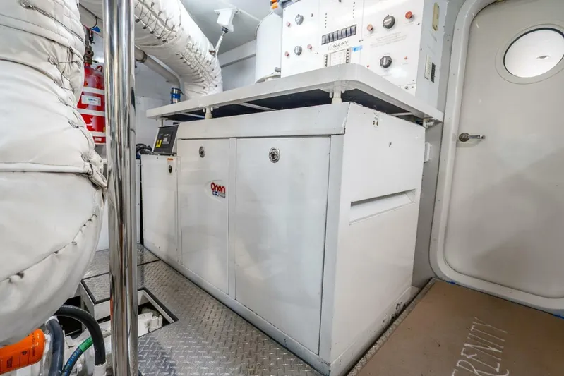 Serenity Yacht Photos Pics Engine room of 2008 Lazzara Motor Yacht with control panels and equipment.
