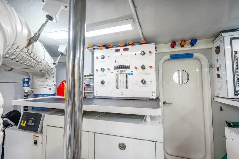 Serenity Yacht Photos Pics Engine room of 2008 Lazzara Motor Yacht with control panels and equipment.