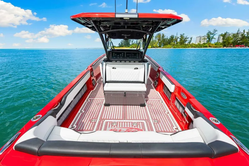  Yacht Photos Pics 2022 Nor-Tech 390 SS boat with red and white interior on a sunny day.