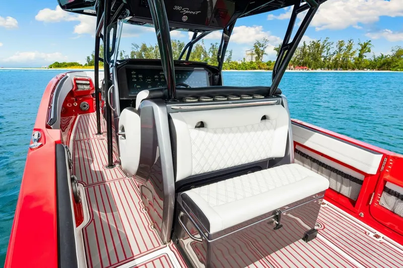  Yacht Photos Pics 2022 Nor-Tech 390 SS boat interior with red accents on a sunny day.