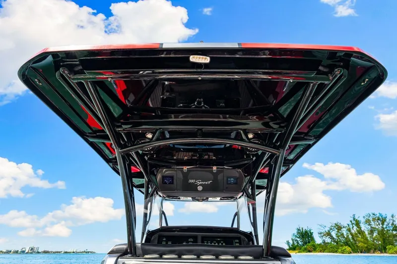  Yacht Photos Pics 2022 Nor-Tech 390 SS boat, viewed from below, against a bright blue sky.