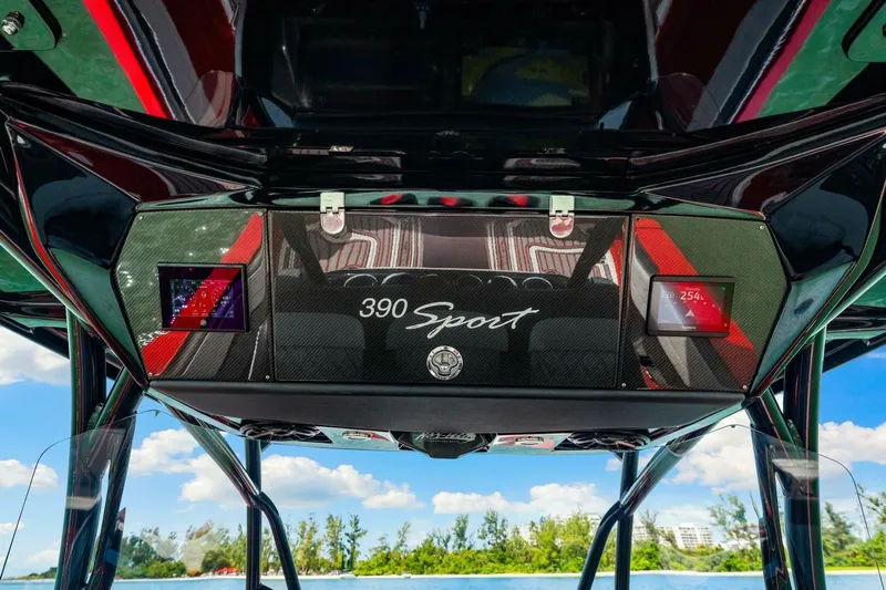  Yacht Photos Pics 2022 Nor-Tech 390 SS boat dashboard with digital displays and "390 Sport" branding.