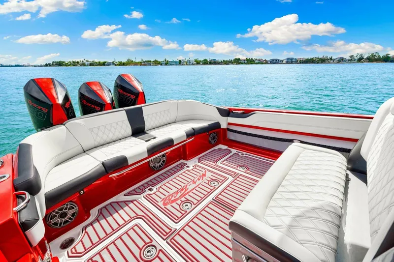 Yacht Photos Pics 2022 Nor-Tech 390 SS boat interior with luxurious seating and triple outboard engines.
