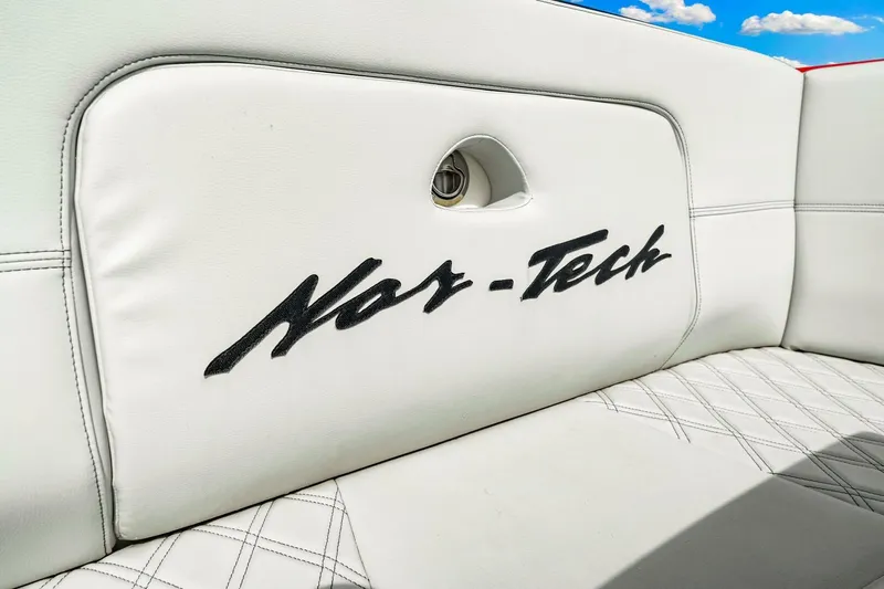  Yacht Photos Pics White leather seating with Nor-Tech logo on 2022 Nor-Tech 390 SS boat.