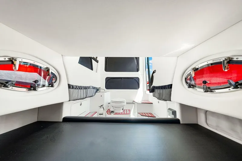  Yacht Photos Pics 2022 Nor-Tech 390 SS cabin interior with modern design and red accents.