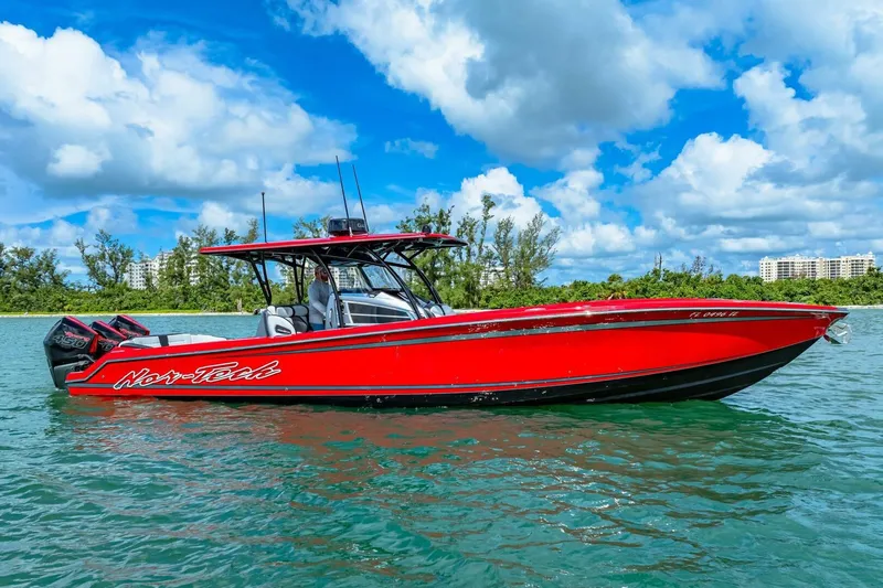  Yacht Photos Pics Red 2022 Nor-Tech 390 SS boat on water under blue sky.