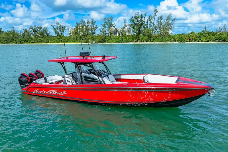 Yacht Photos Pics Red 2022 Nor-Tech 390 SS boat on water, featuring triple outboard engines.