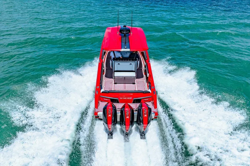  Yacht Photos Pics Red 2022 Nor-Tech 390 SS boat cruising on clear blue water.