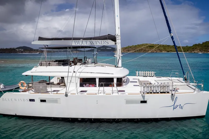 Bluewinds Yacht Photos Pics 2014 Lagoon 560 S2 catamaran "Blue Winds" sailing in clear turquoise waters.