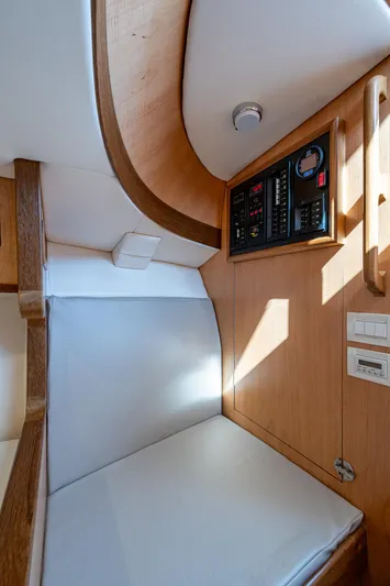 Dreams Afloat Yacht Photos Pics 2019 Custom Carolina Custom Express cabin interior with control panel and seating.