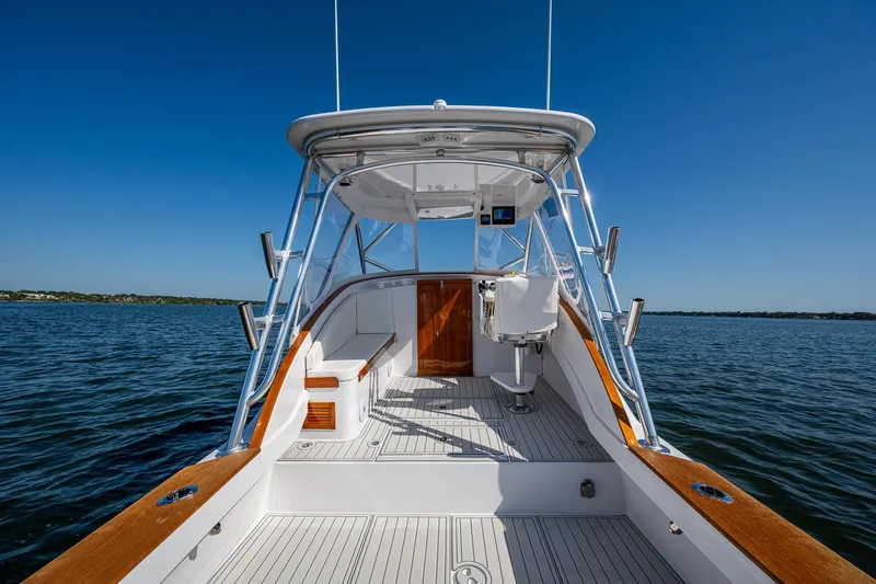 Dreams Afloat Yacht Photos Pics 2019 Custom Carolina Custom Express boat on open water, showcasing sleek design and spacious deck.