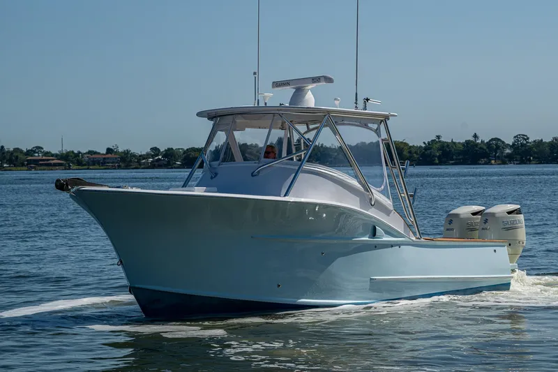 Dreams Afloat Yacht Photos Pics 2019 Custom Carolina Custom Express boat cruising on a calm lake.