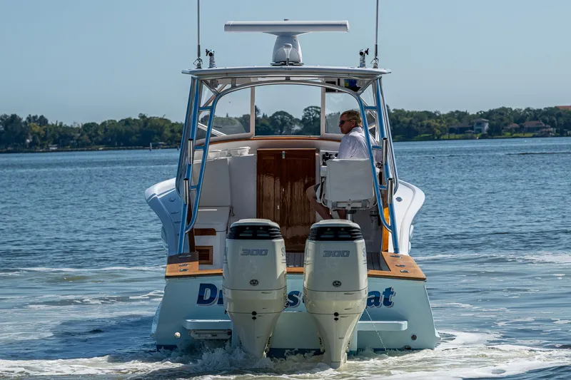 Dreams Afloat Yacht Photos Pics 2019 Custom Carolina Custom Express boat cruising on a calm lake.