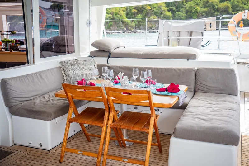 Bluewinds Yacht Photos Pics Luxurious dining area on 2023 Lagoon 560 S2 yacht with elegant table setting.