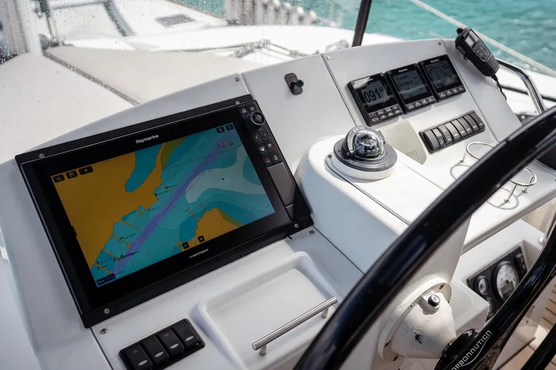 Bluewinds Yacht Photos Pics Helm of 2023 Lagoon 560 S2 yacht with navigation equipment and controls.