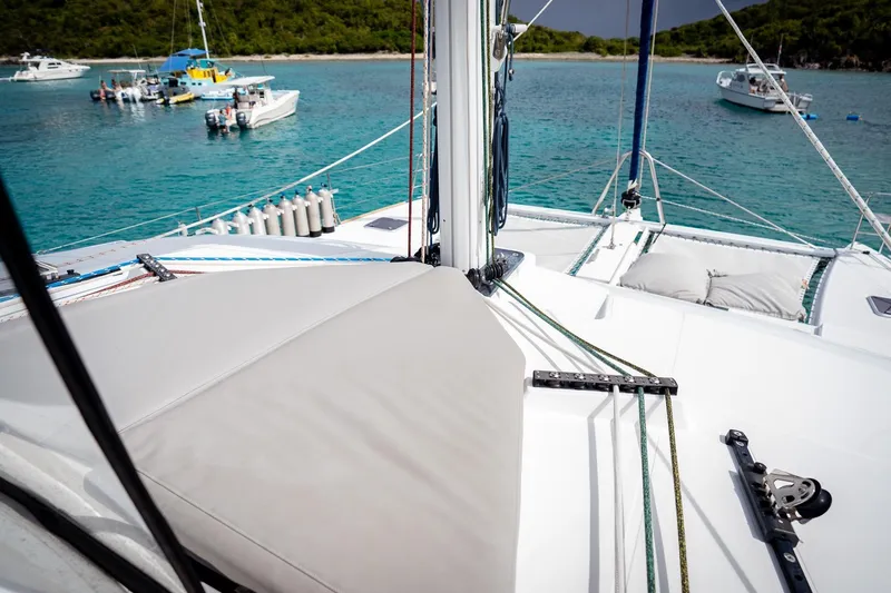 Bluewinds Yacht Photos Pics 2023 Lagoon 560 S2 catamaran deck with scenic ocean view and nearby boats.