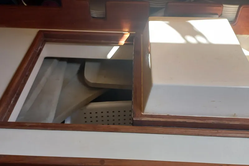 Ivory Star Yacht Photos Pics Interior view of a 1999 Island Packet 350 sailboat, featuring a wooden hatch.