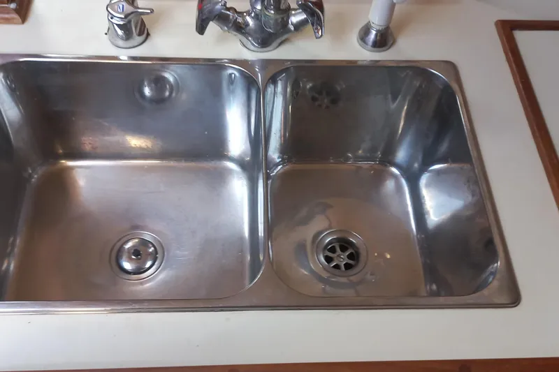 Ivory Star Yacht Photos Pics Stainless steel double sink on Island Packet 350 yacht, 1999 model.