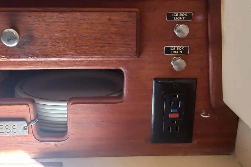 Ivory Star Yacht Photos Pics Interior of 1999 Island Packet 350 sailboat with ice box controls and electrical outlet.