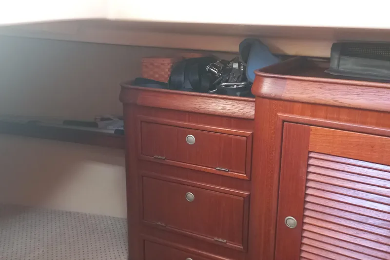 Ivory Star Yacht Photos Pics Interior of 1999 Island Packet 350 sailboat with wooden cabinetry and storage.