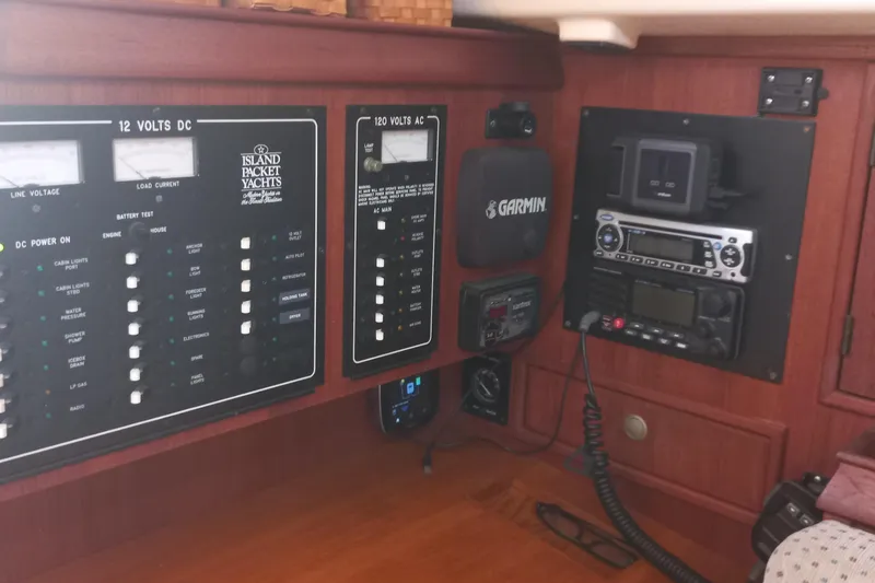 Ivory Star Yacht Photos Pics Control panel of a 1999 Island Packet 350 yacht with navigation and communication equipment.