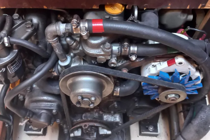 Ivory Star Yacht Photos Pics Engine components of a 1999 Island Packet 350 sailboat, featuring hoses and belts.