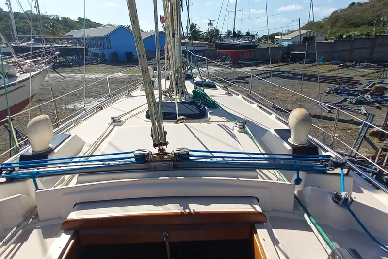 Ivory Star Yacht Photos Pics 1999 Island Packet 350 sailboat deck with rigging, docked in a boatyard.