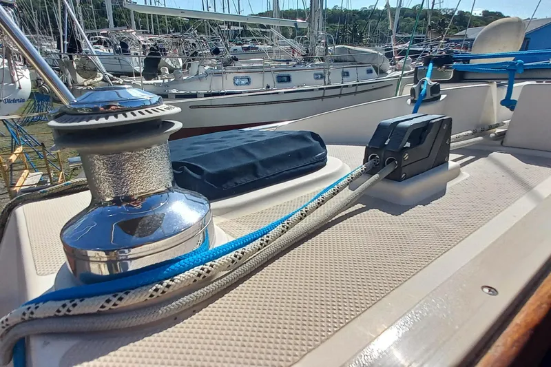 Ivory Star Yacht Photos Pics Close-up of 1999 Island Packet 350 sailboat deck with winch and ropes.